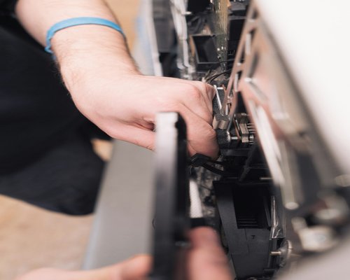 Professional technician diagnostic process on kitchen washing machine