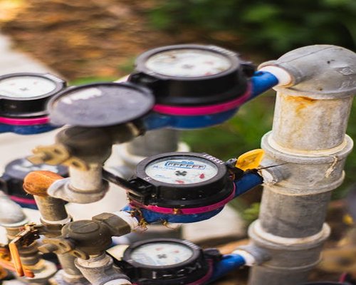 Earthy apartment maintenance check including water lines and pipes